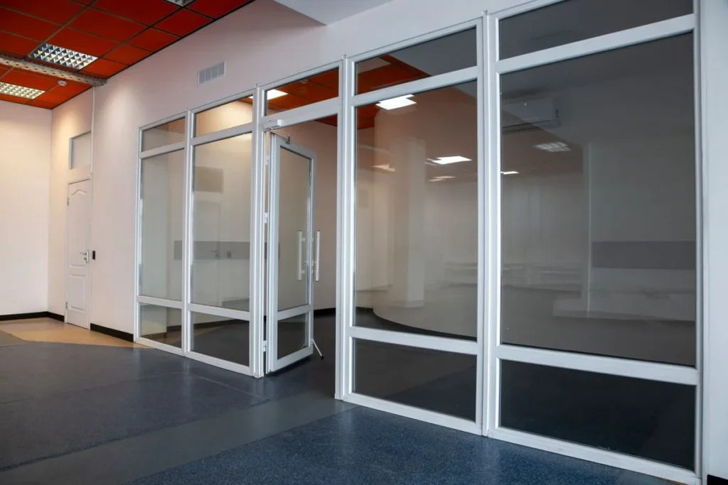 Office partition with framed glass walls and doors in a newly leased office